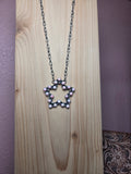 Pink conch star necklace